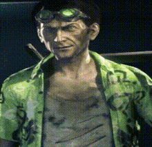 a man wearing a green shirt that says ' tl ' on it
