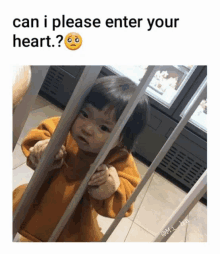 a baby behind bars with the caption can i please enter your heart ?