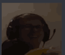 a blurry picture of a person wearing headphones and a microphone