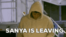 a man in a hoodie says sanya is leaving in black letters