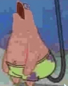 patrick star from spongebob squarepants is holding onto a fishing hook .