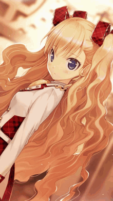 a girl with long blonde hair has a red bow in her hair