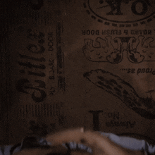 a man and a woman are laying on a bed with the word chic on the wall in the background