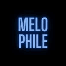 a logo for melo philie is glowing in the dark on a black background .