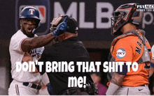 a baseball player with the letter t on his helmet is talking to a referee