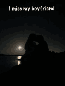 a silhouette of a man and woman kissing with the words i miss my boyfriend above them