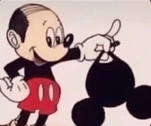 a cartoon of mickey mouse is holding a black bag