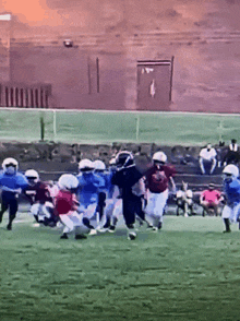 a football game is being played in front of a stadium