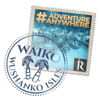 a postage stamp that says adventure anywhere is next to a postcard