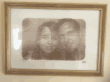 a framed drawing of a man and a woman with the name donald on the bottom left