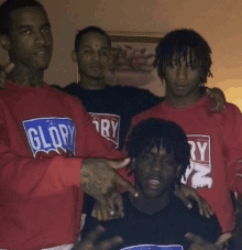 a group of men wearing red glory shirts