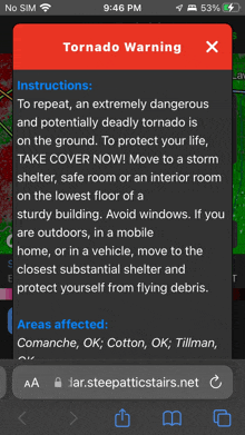 a phone screen shows a tornado warning