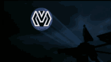 a man in a suit is standing in front of a blue circle with the letter m on it