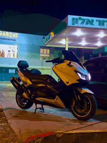 a scooter is parked in front of a building that says darzat fashion boutique