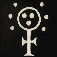 a white symbol on a black background with circles and a cross in the middle