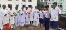 a group of children holding up indian flags with a samsung triple camera shot