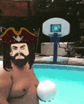 a man with a beard wearing a pirate hat sits in a pool