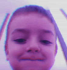 a close up of a child 's face with a purple and blue background