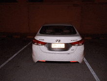 a hyundai elantra is parked in a dark parking lot