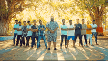 a group of young men are posing for a picture with their arms crossed