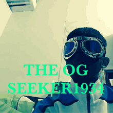 a man wearing a mask and goggles with the words the og seeker 1934 on the bottom