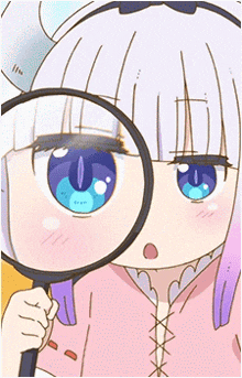 a girl with a magnifying glass looking at her eyes