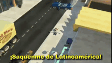 an aerial view of a city street with a sign that says `` saquenme de latinoamerica '' in spanish .