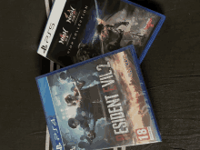 two ps4 games are stacked on top of each other with one being resident evil 2