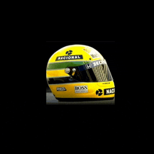 a yellow helmet with the word nacional on the top