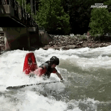 a person is riding a kayak in a river and the words awesome are on the bottom of the screen