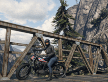 a person riding a motorcycle on a bridge with a mountain in the background