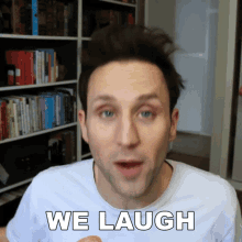 a man in a white shirt says " we laugh "