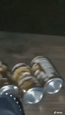 a bunch of cans of beer are sitting on a table .