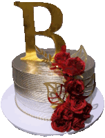 a silver and gold cake with red roses and a gold letter b