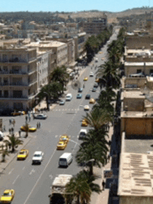 an aerial view of a city street with lots of cars