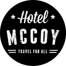 a logo for hotel mccoy that says travel for all