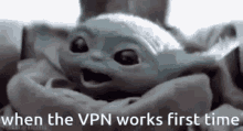 a baby yoda is sitting in a blanket with the words `` when the vpn works first time '' written below it .