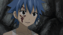 a young boy with blue hair has a tattoo on his face