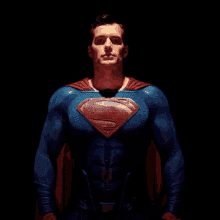 a man in a blue and red superman costume