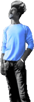 a man wearing a blue shirt and black pants stands with his hands in his pockets