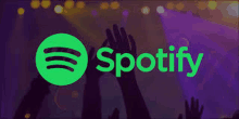 a spotify logo with people 's hands in the air