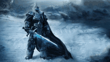 a knight with a sword and a crown is kneeling down in the snow