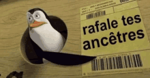 a penguin is sticking its head out of a hole in a piece of paper that says rafale tes ancestres