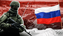 a soldier stands in front of a russian flag in the snow