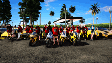 a group of people are posing for a picture in front of motorcycles and cars