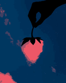 a silhouette of a hand holding a pink flower in the sky