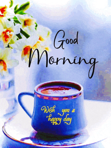 a cup of coffee with the words good morning wish you a happy day written on it