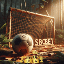 a soccer ball sits in front of a soccer goal with the word sbobet on it