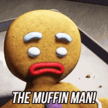 a gingerbread man with tears in his eyes and the words " the muffin man " below him