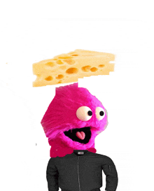 a pink sesame street character is wearing a black jacket and has a piece of cheese on his head